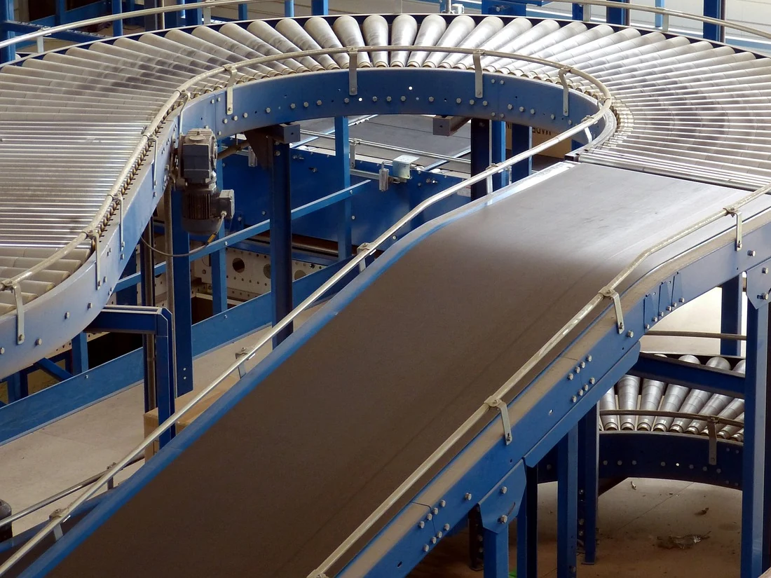 Curved roller conveyor and belt conveyor illustrating material-handling equipment